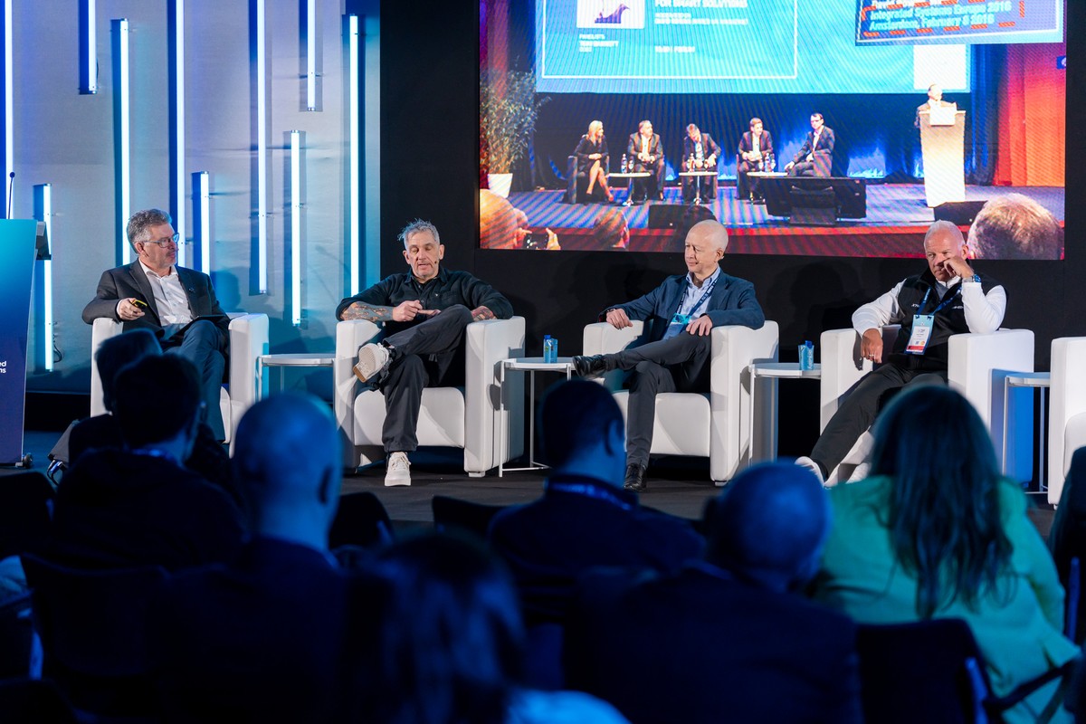 Byron facilitating a panel discussion at ISE Megatrends, with the audience in the foreground