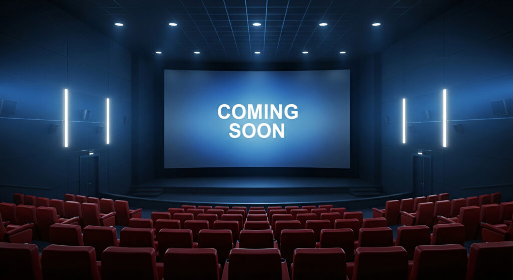 empty movie theater with screen displaying coming soon